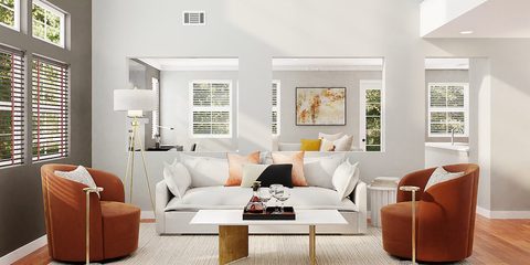 Bright living room with a white sofa and hardwood floors